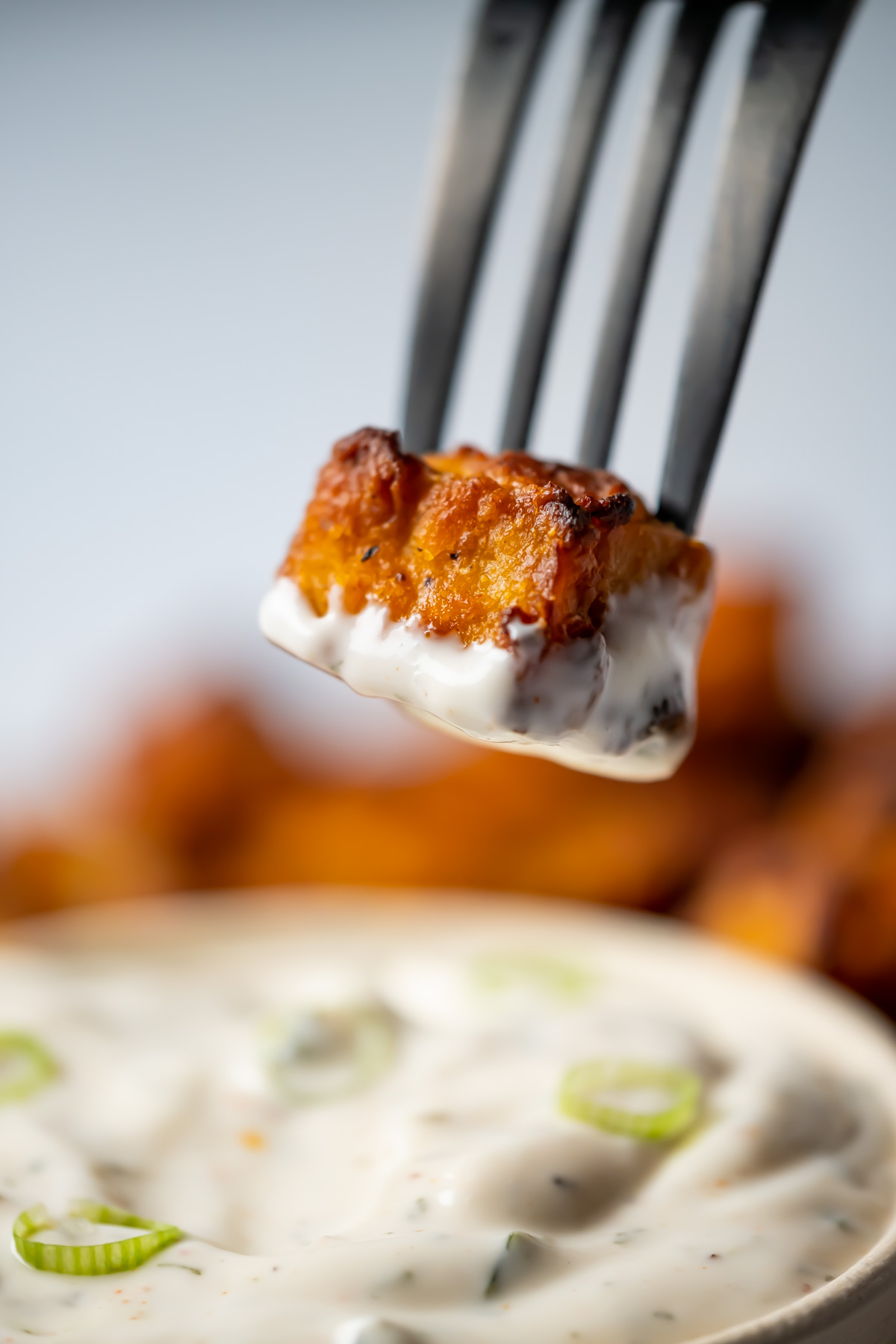 Air fried tofu dipped in ranch dressing.