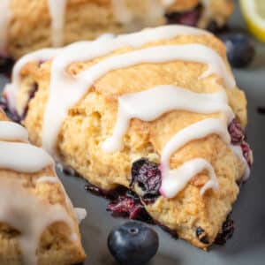 Vegan blueberry scones on a gray plate.