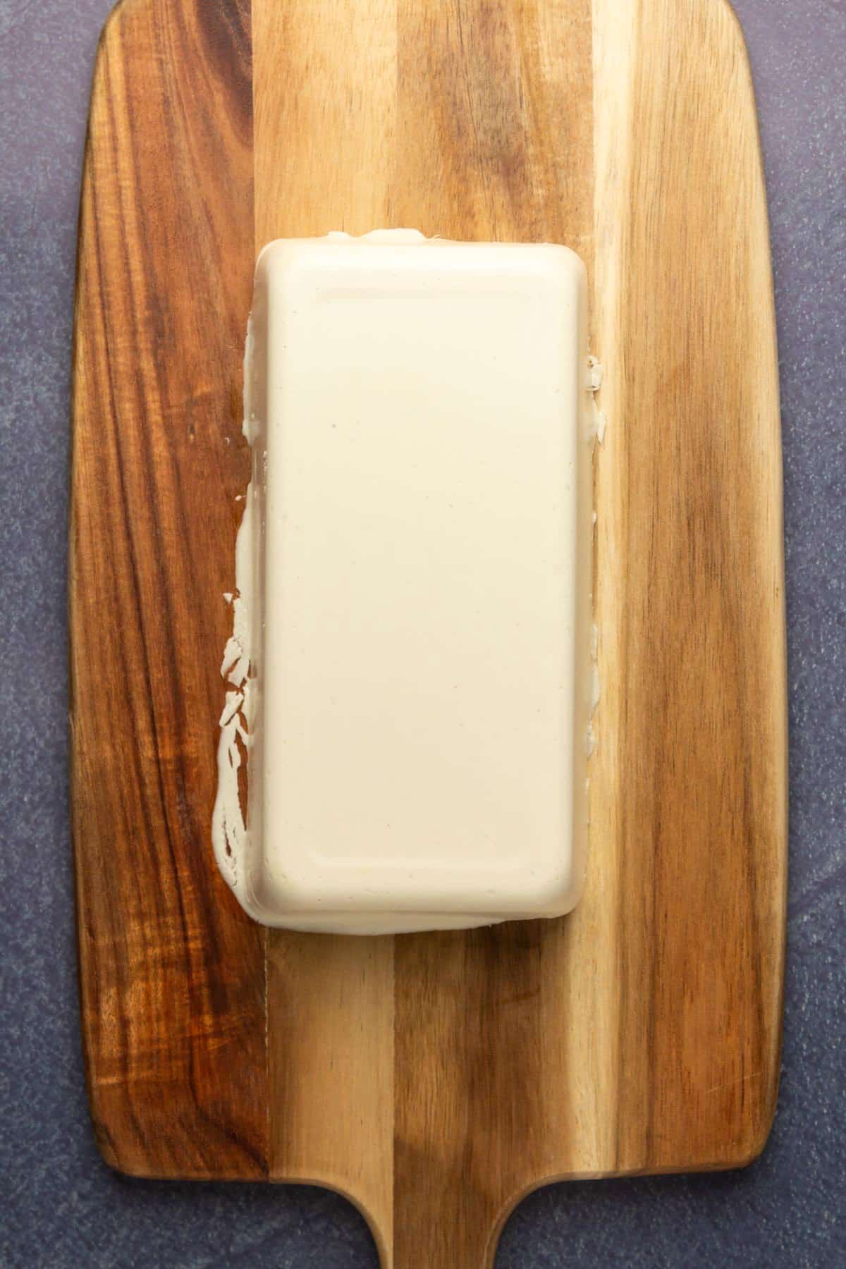 Vegan cheese on a cutting board.