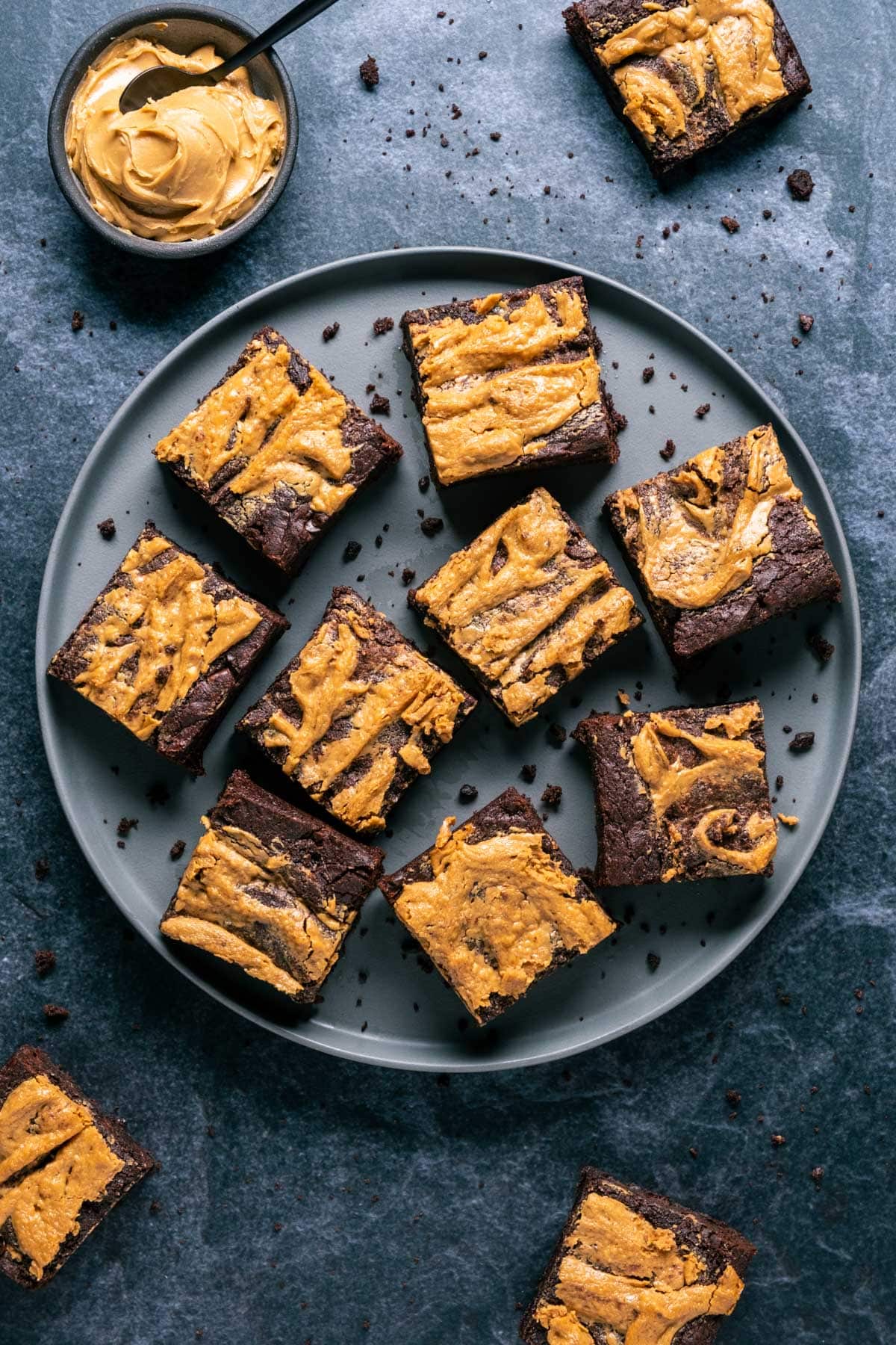Peanut butter brownies on a gray plate.